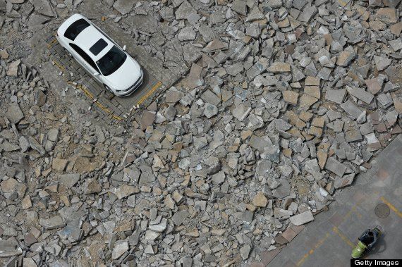 Chinese car left on destroyed road