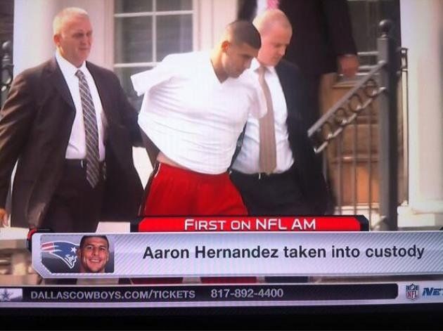 Aaron Hernandez led from home in handcuffs