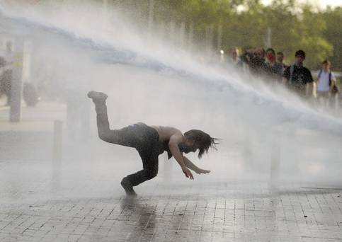 protester hit by water in turkey