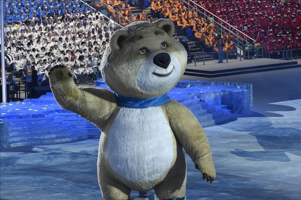 Sochi bear blows out torch